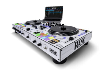 Low-angle view of RANE ONE MKII DJ controller connected to laptop running Serato DJ Pro, highlighting RGB pads, motorized platters