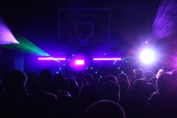Crowd view perspective from a School Dance with a Black Light Glow Theme